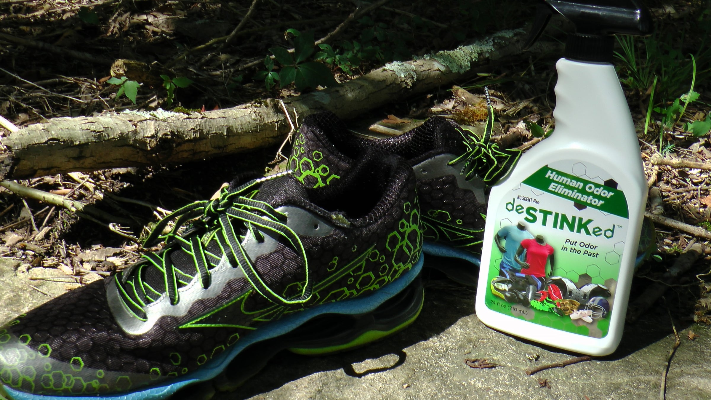 deSTINKed Human Odor Eliminator with running shoes on wooded trail